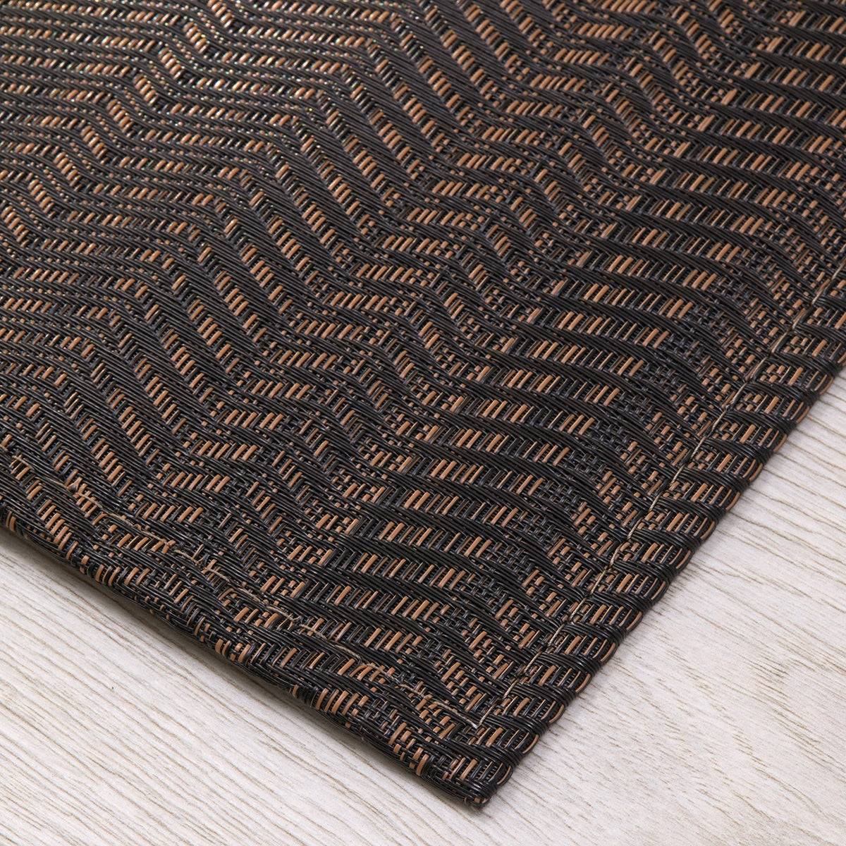 Wave / Tiger Eye woven floor mat by Chilewich, interior setting