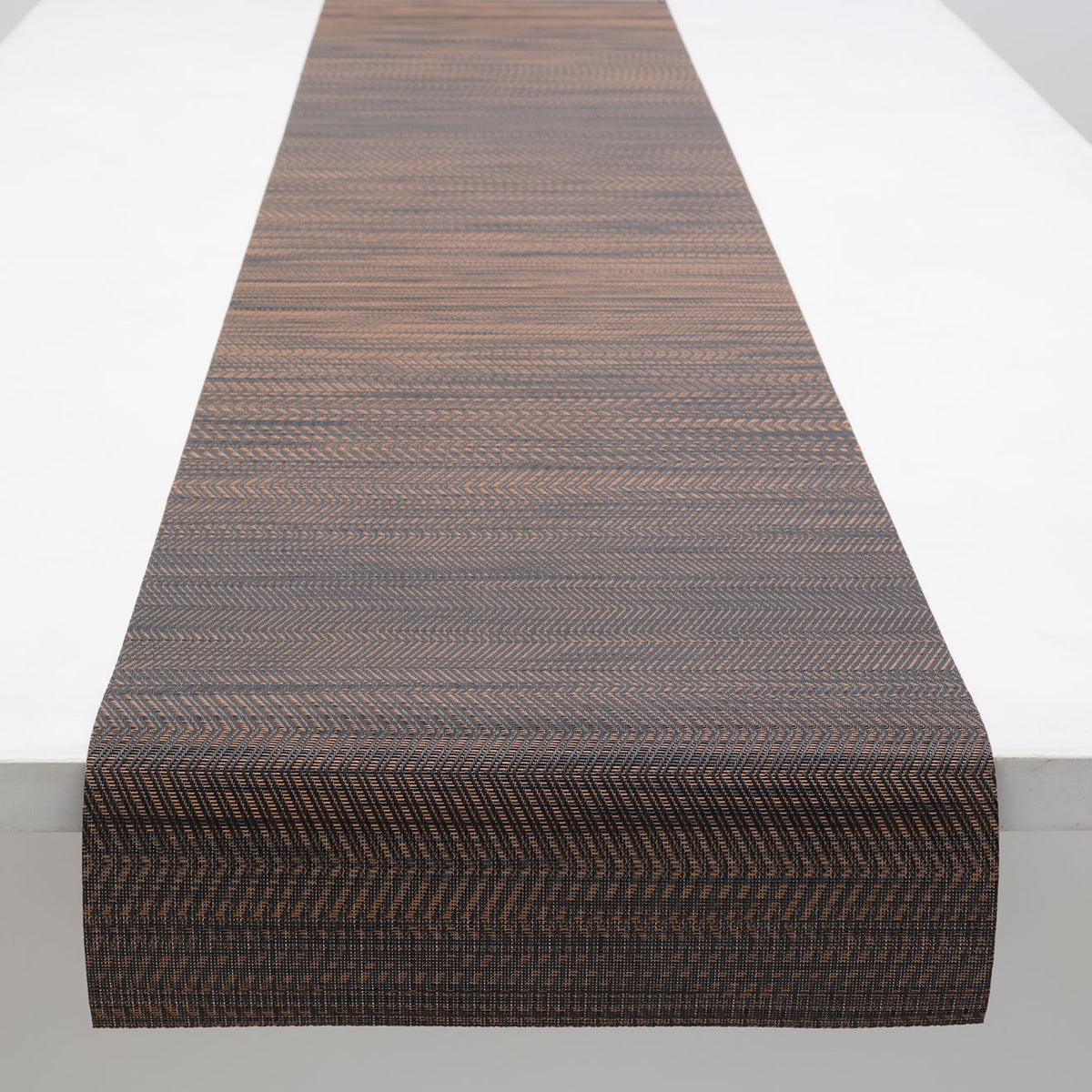 Chilewich Wave runner in Tiger Eye, draped along a table