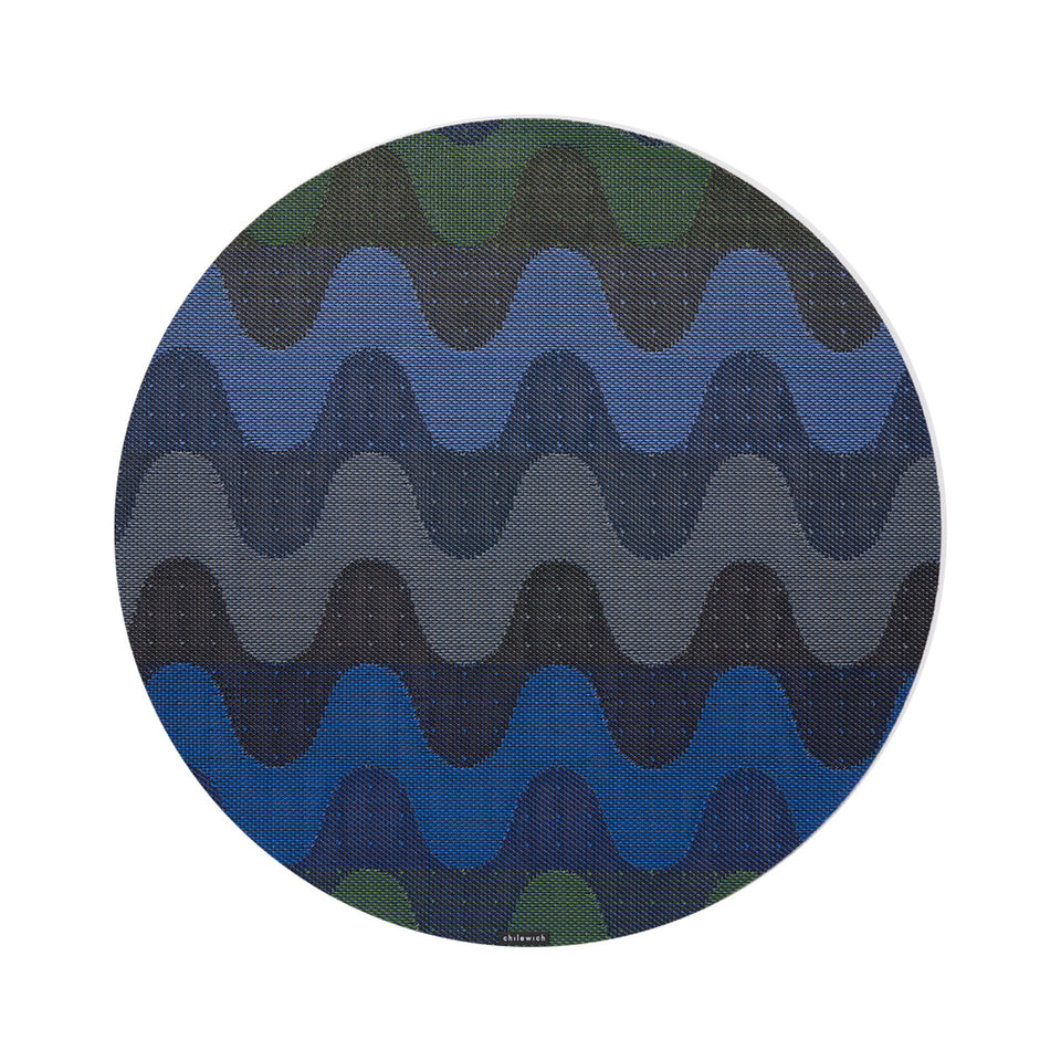 Chilewich Wiggle round placemat in Deep Sea, viewed from above on a white background