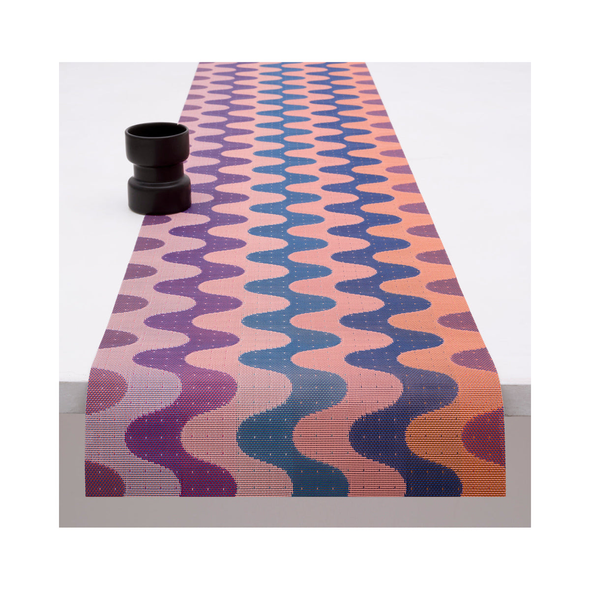 Chilewich Wiggle table runner in Heatwave, draped across a table