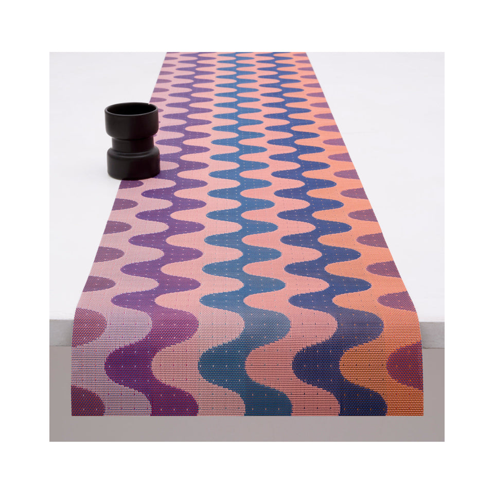 Chilewich Wiggle table runner in Heatwave, draped across a table