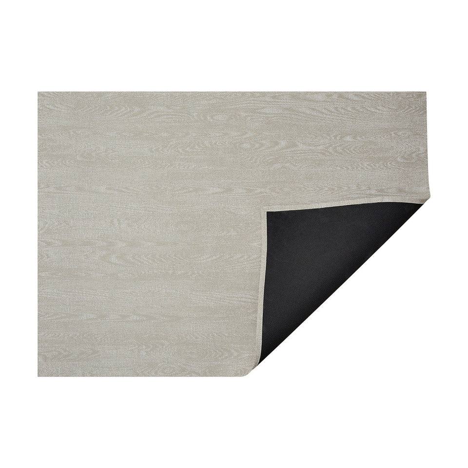 Birch Woodgrain woven floor mat by Chilewich, horizontal folded-corner view