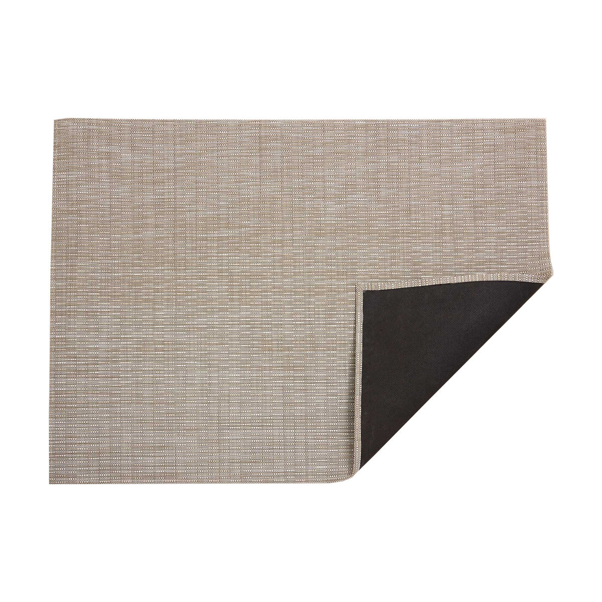 Thatch / Pebble woven floor mat by Chilewich, folded-corner studio view