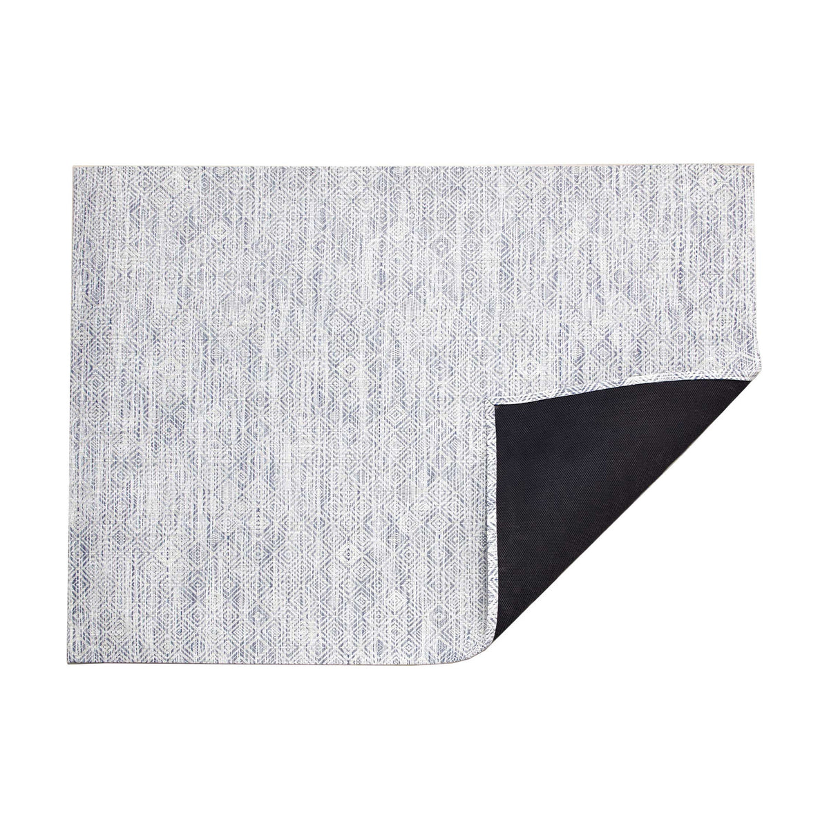 Mosaic / Blue woven floor mat by Chilewich, folded-corner studio view