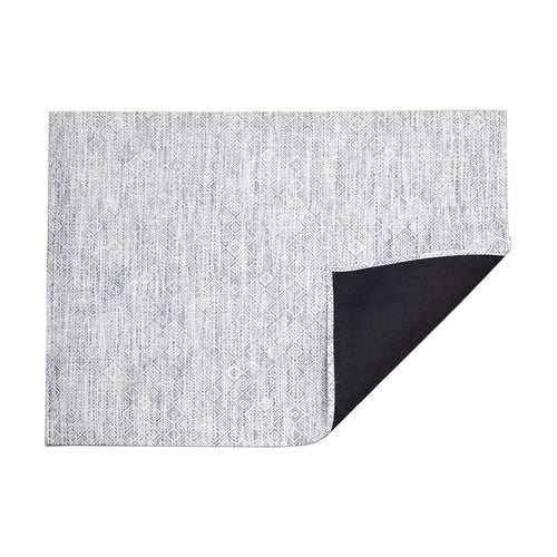 Mosaic / Blue woven floor mat by Chilewich, folded-corner studio view
