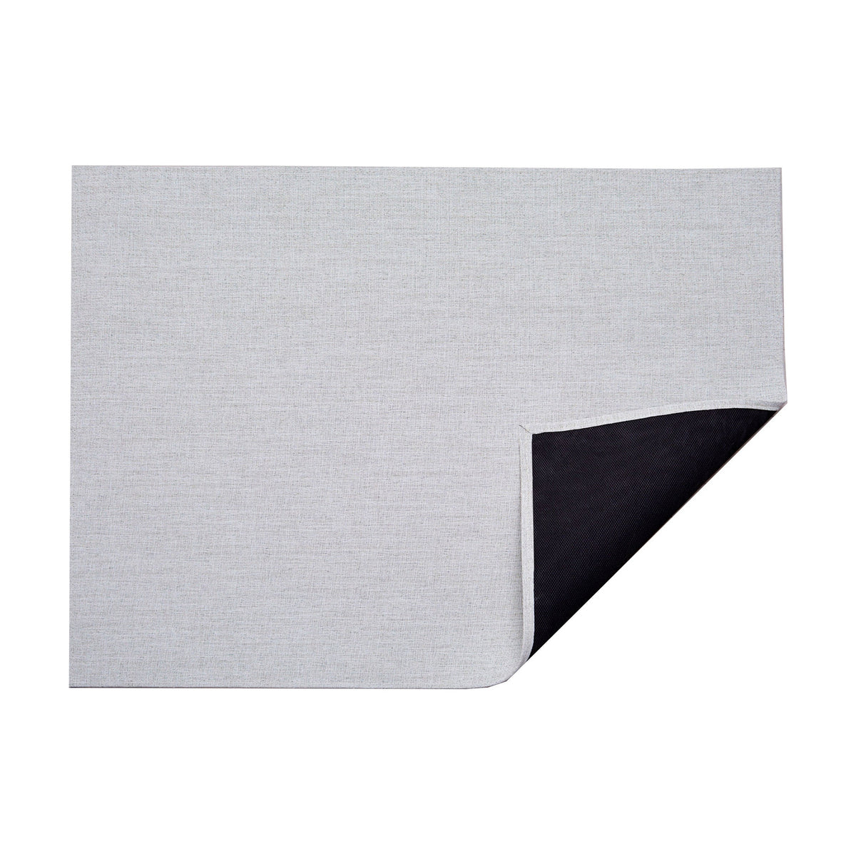 Bouclé / Marshmallow woven floor mat by Chilewich, folded-corner studio view