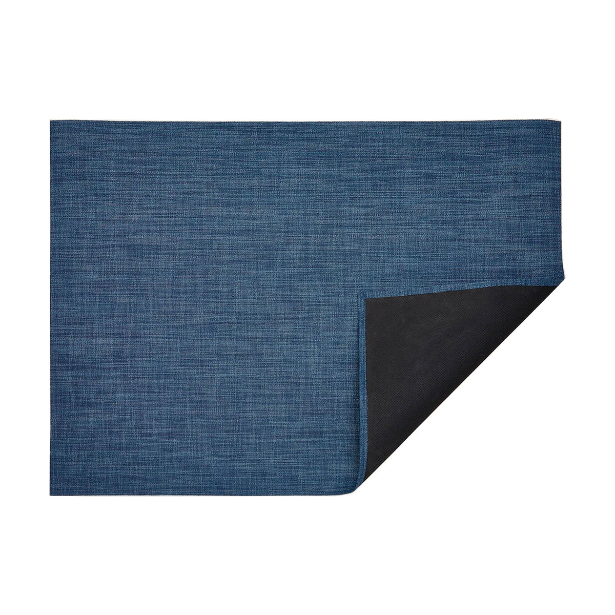 Bouclé / Blueberry woven floor mat by Chilewich, folded-corner studio view