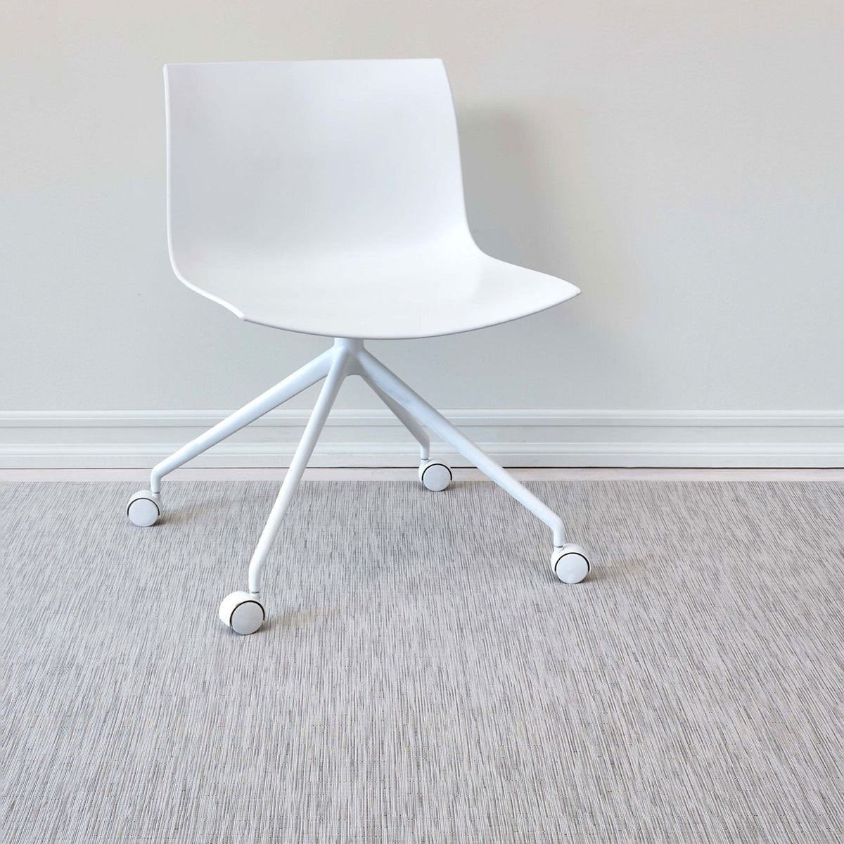Bamboo / Chalk woven floor mat by Chilewich, interior setting