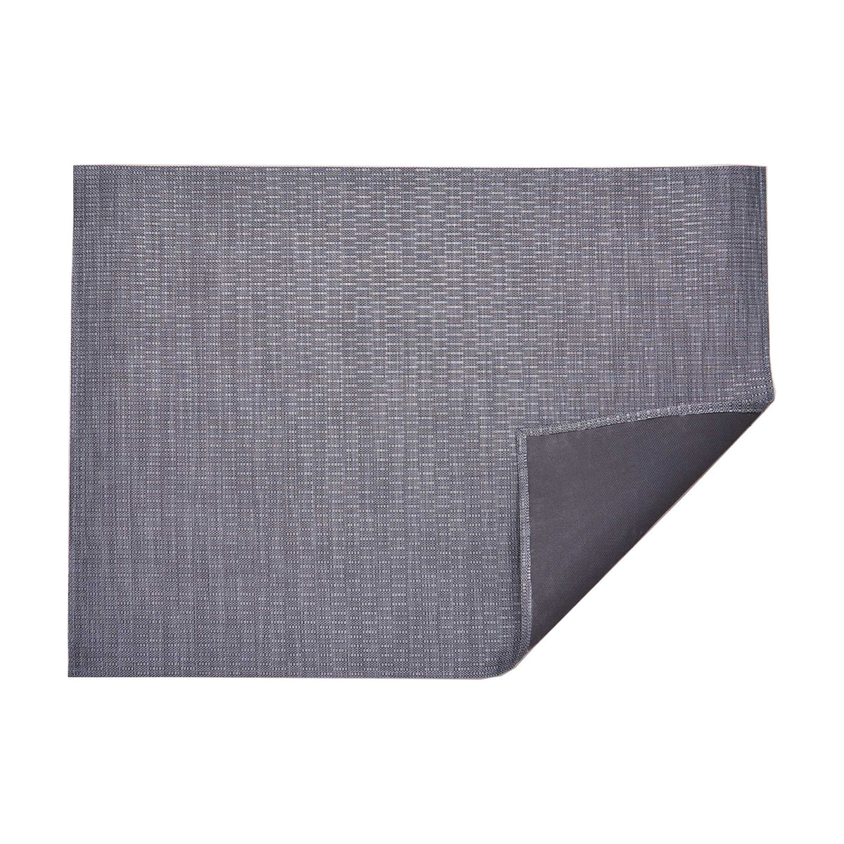 Thatch / Pewter woven floor mat by Chilewich, folded-corner studio view