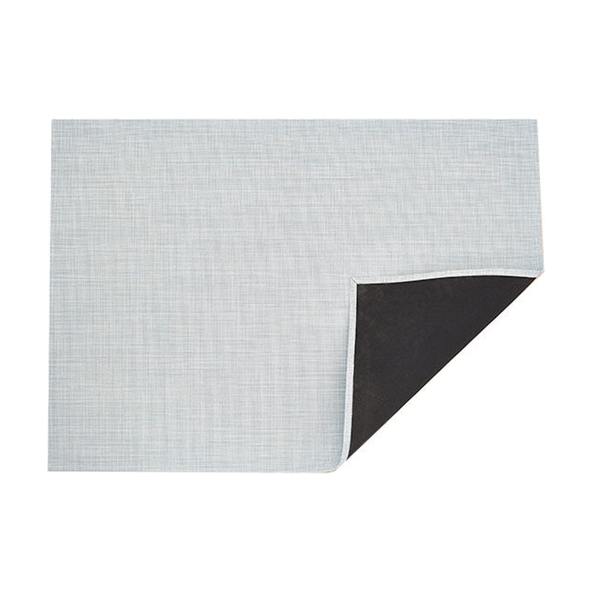 Mini Basketweave / Sky woven floor mat by Chilewich, folded-corner studio view