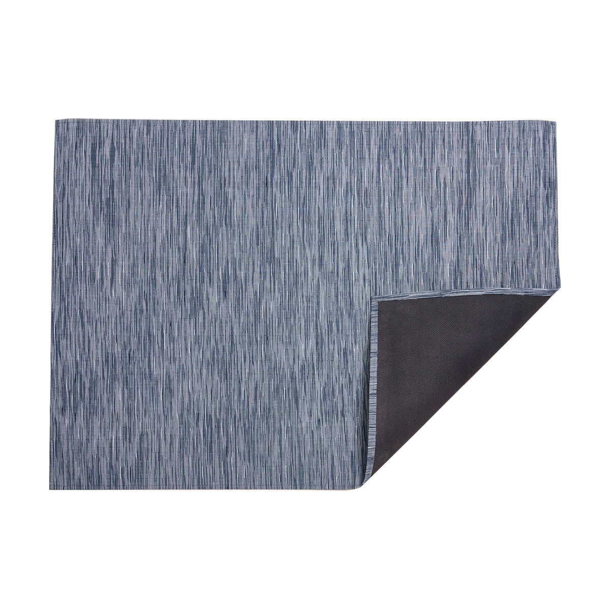 Bamboo / Rain woven floor mat by Chilewich, folded-corner studio view