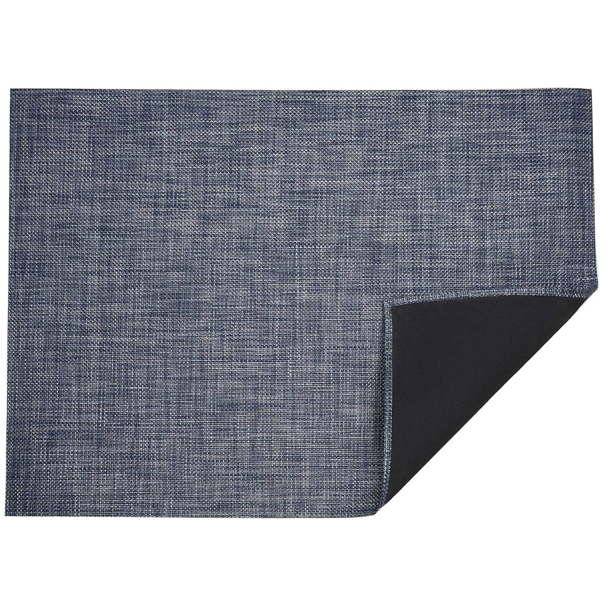 Basketweave / Denim woven floor mat by Chilewich, folded-corner studio view