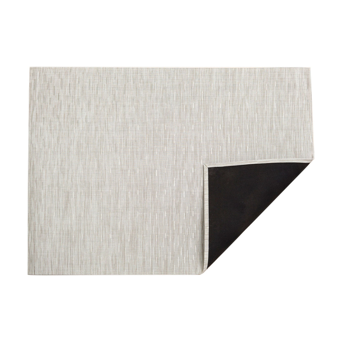Bamboo / Coconut woven floor mat by Chilewich, folded-corner studio view