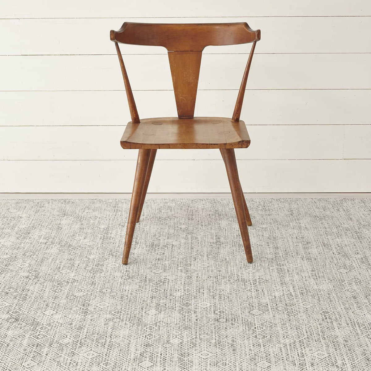 Mosaic / White/Black woven floor mat by Chilewich, interior setting