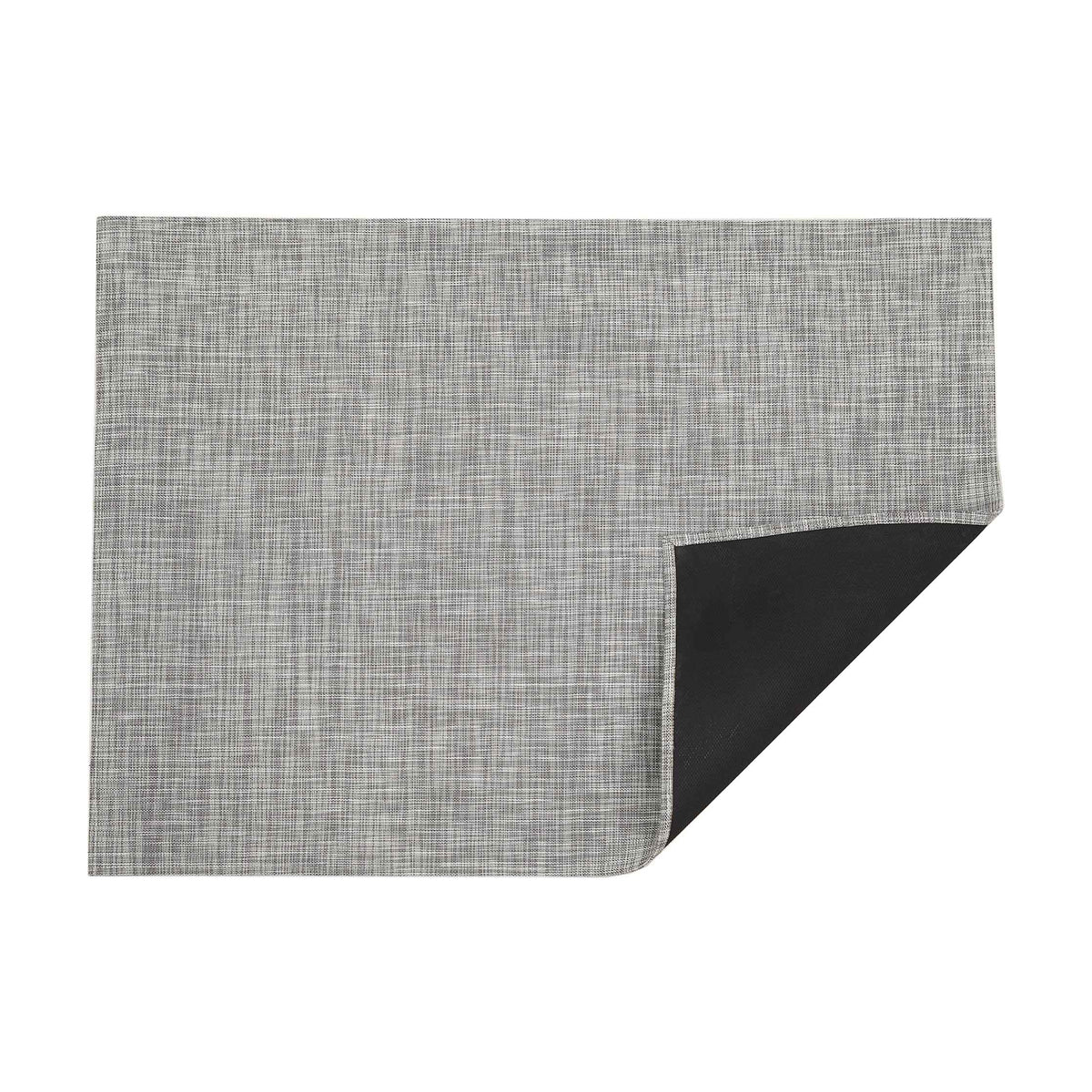 Ikat / White/Silver woven floor mat by Chilewich, folded-corner studio view