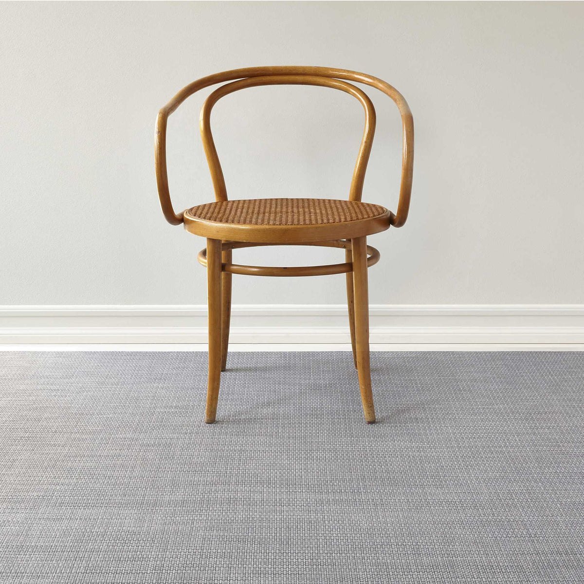 Basketweave / Shadow woven floor mat by Chilewich, interior setting