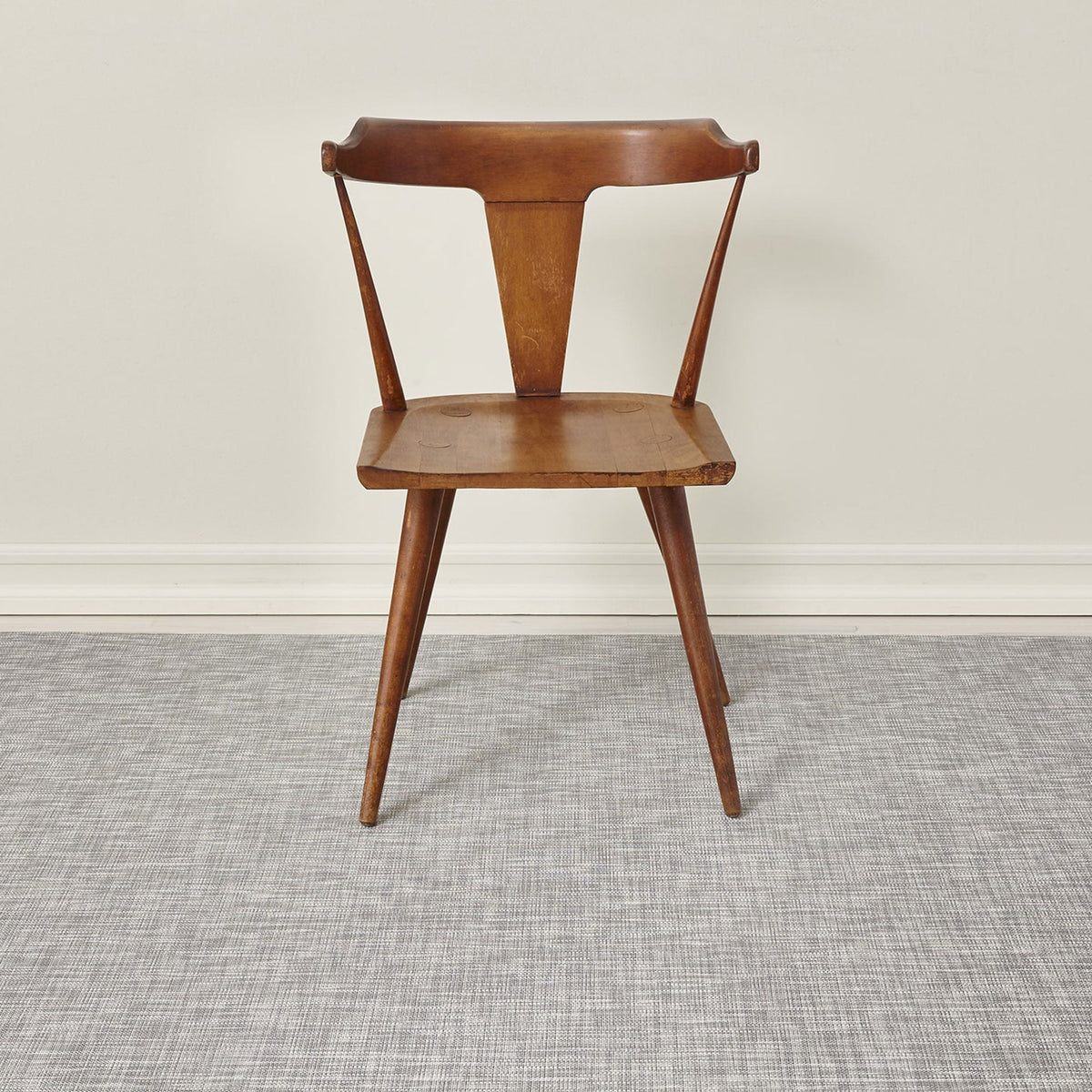 Ikat / White/Silver woven floor mat by Chilewich, interior setting