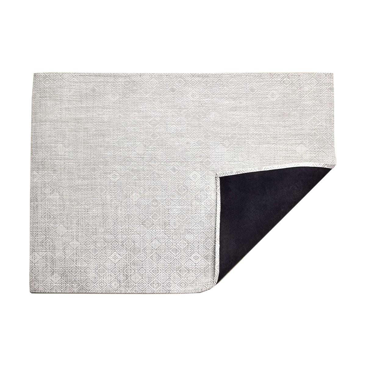 Mosaic / Grey woven floor mat by Chilewich, folded-corner studio view