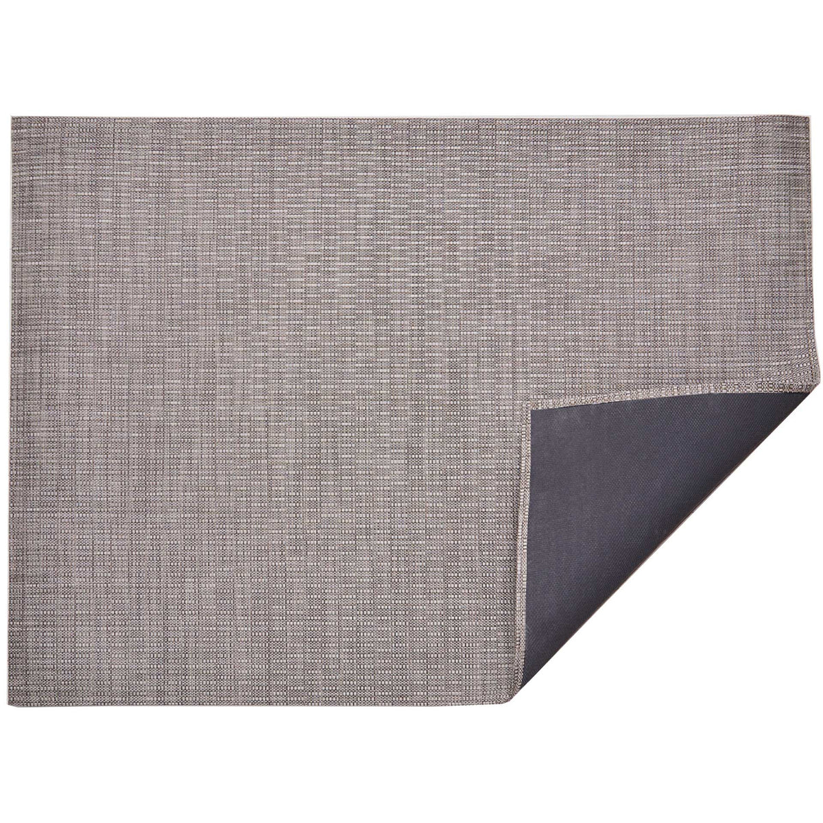 Thatch / Umber woven floor mat by Chilewich, folded-corner studio view