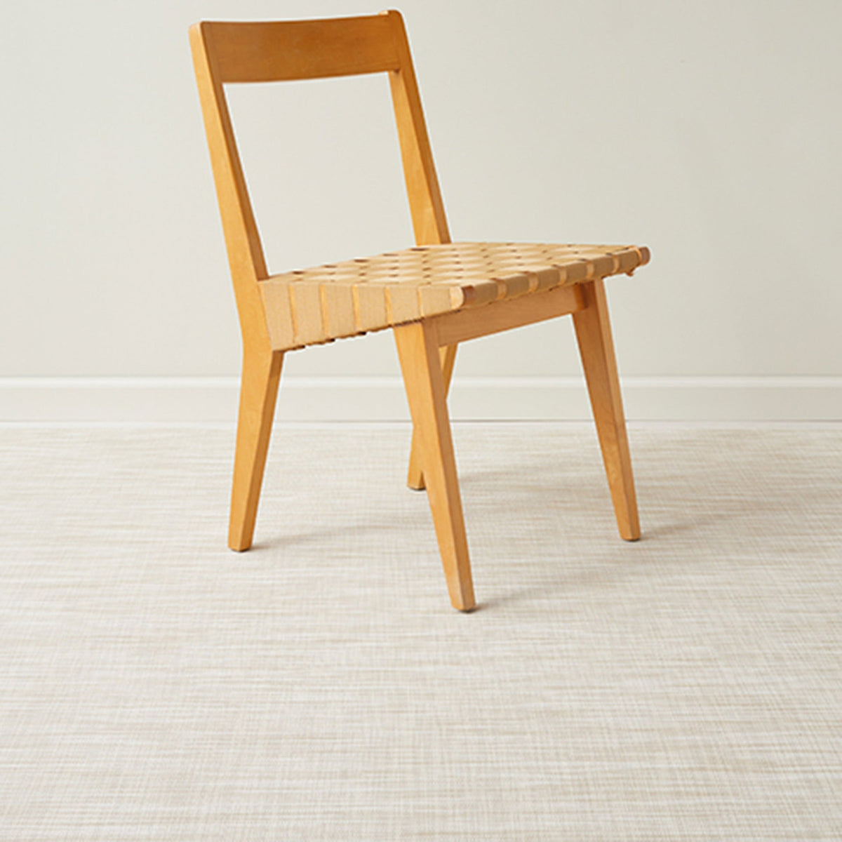 Ikat / Bone woven floor mat by Chilewich, interior setting