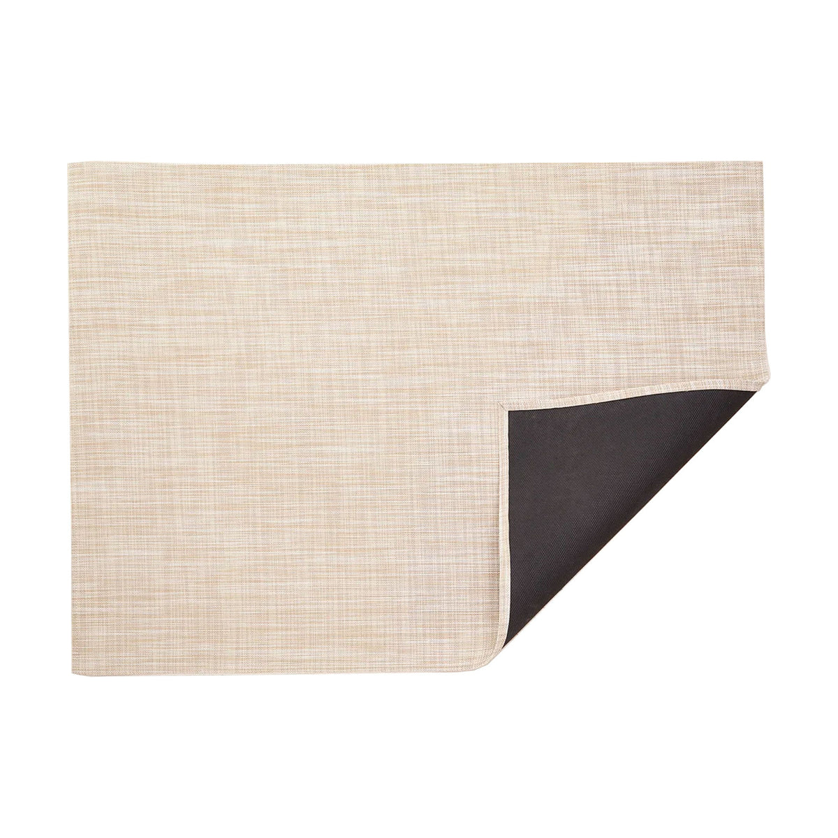 Ikat / Bone woven floor mat by Chilewich, folded-corner studio view