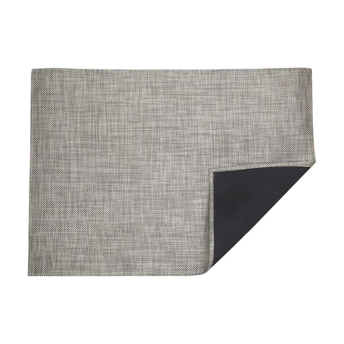 Basketweave / Oyster woven floor mat by Chilewich, folded-corner studio view