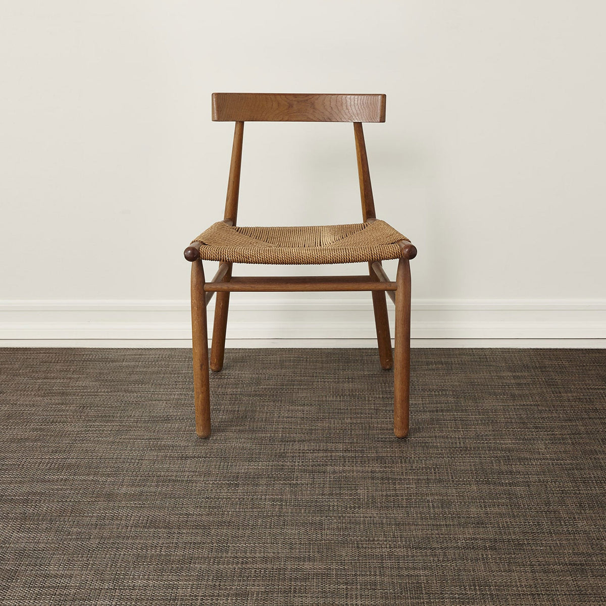 Basketweave / Earth woven floor mat by Chilewich, interior setting