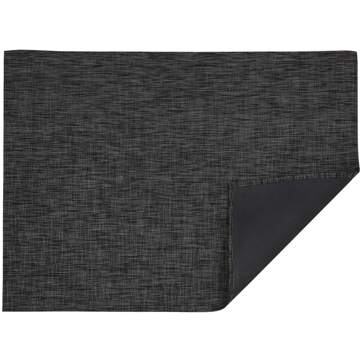 Ikat / Deep Grey woven floor mat by Chilewich, folded-corner studio view