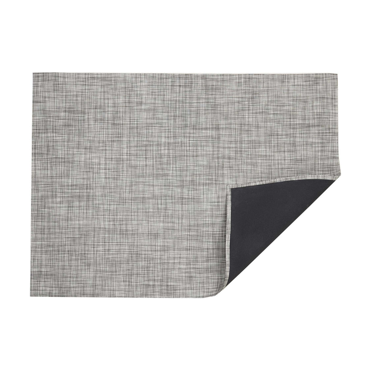 Mini Basketweave / Gravel woven floor mat by Chilewich, folded-corner studio view