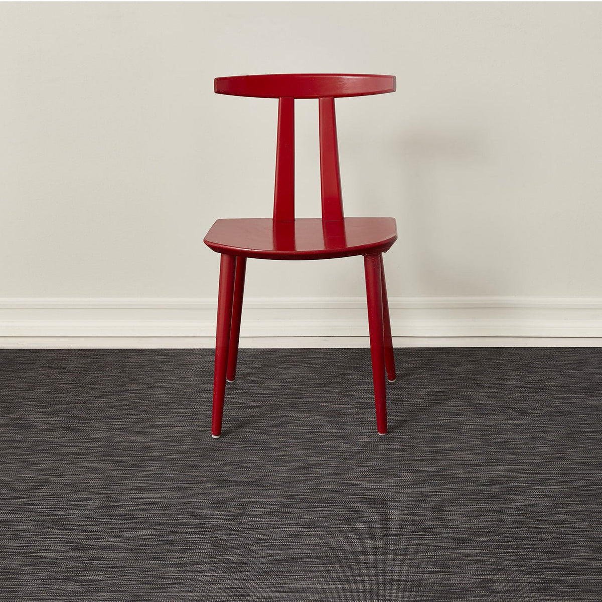 Ikat / Deep Grey woven floor mat by Chilewich, interior setting