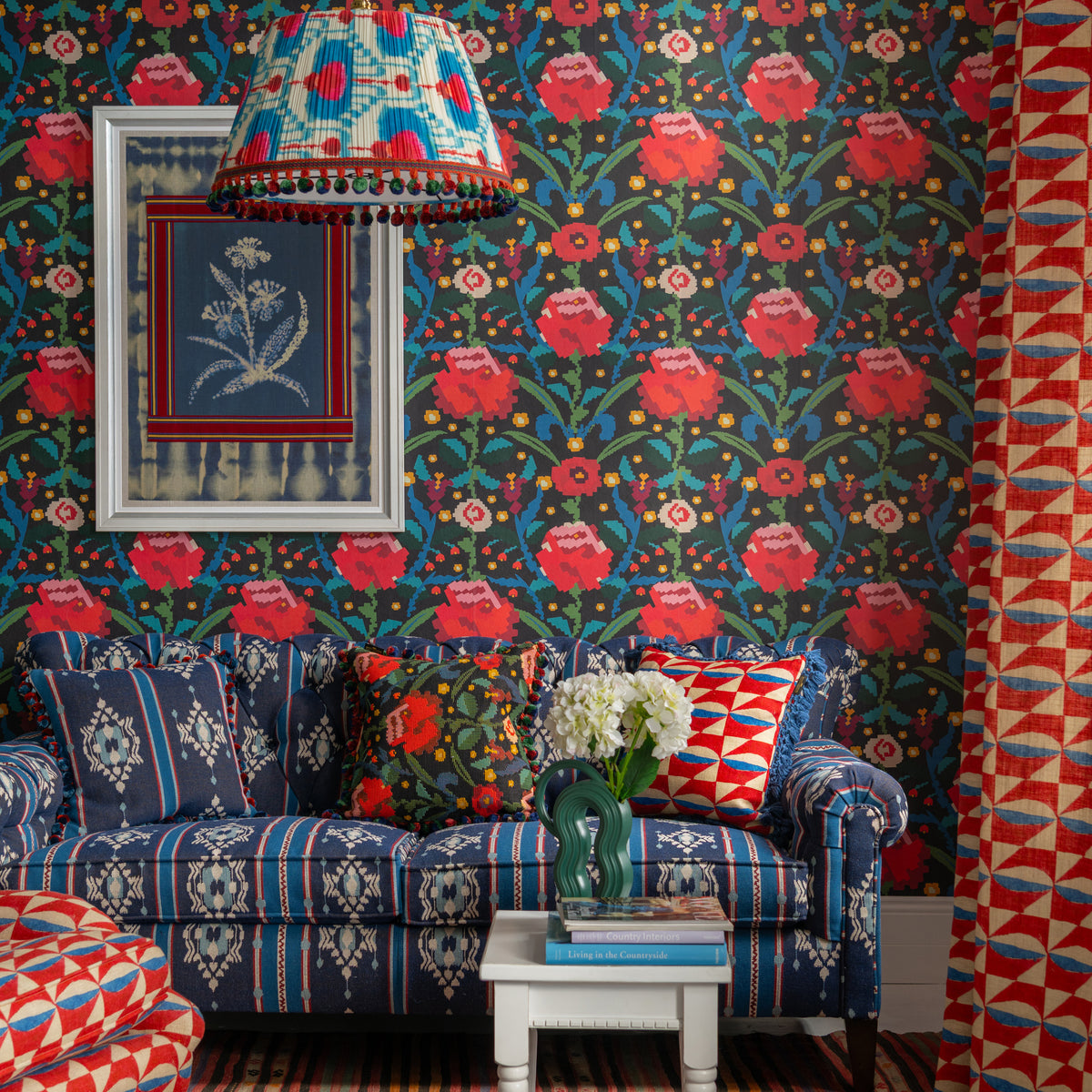 Claudine wallpaper by MINDTHEGAP, shown in a furnished interior.