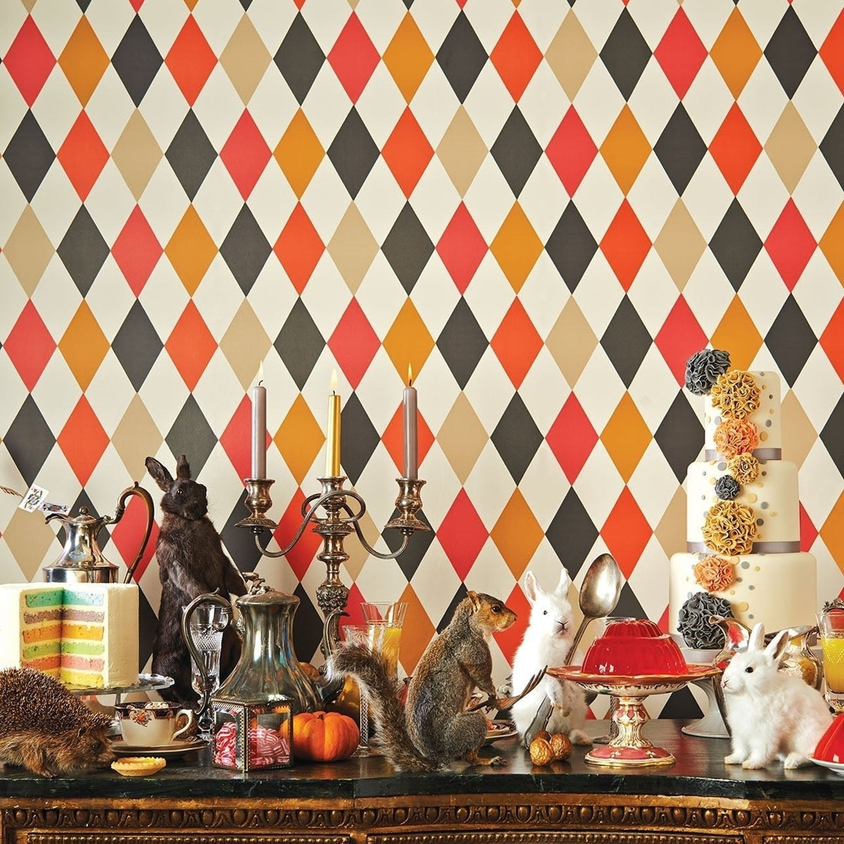 Cole & Son punchinello wallpaper in Reds & Charcoal on Parchment — lifestyle