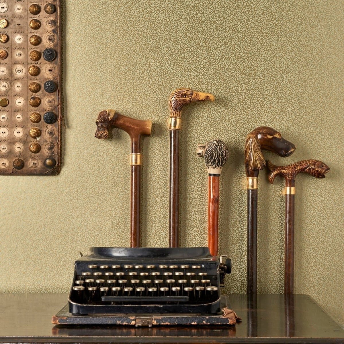 Cole & Son goldstone wallpaper in Metallic Gold on Soft Olive — lifestyle