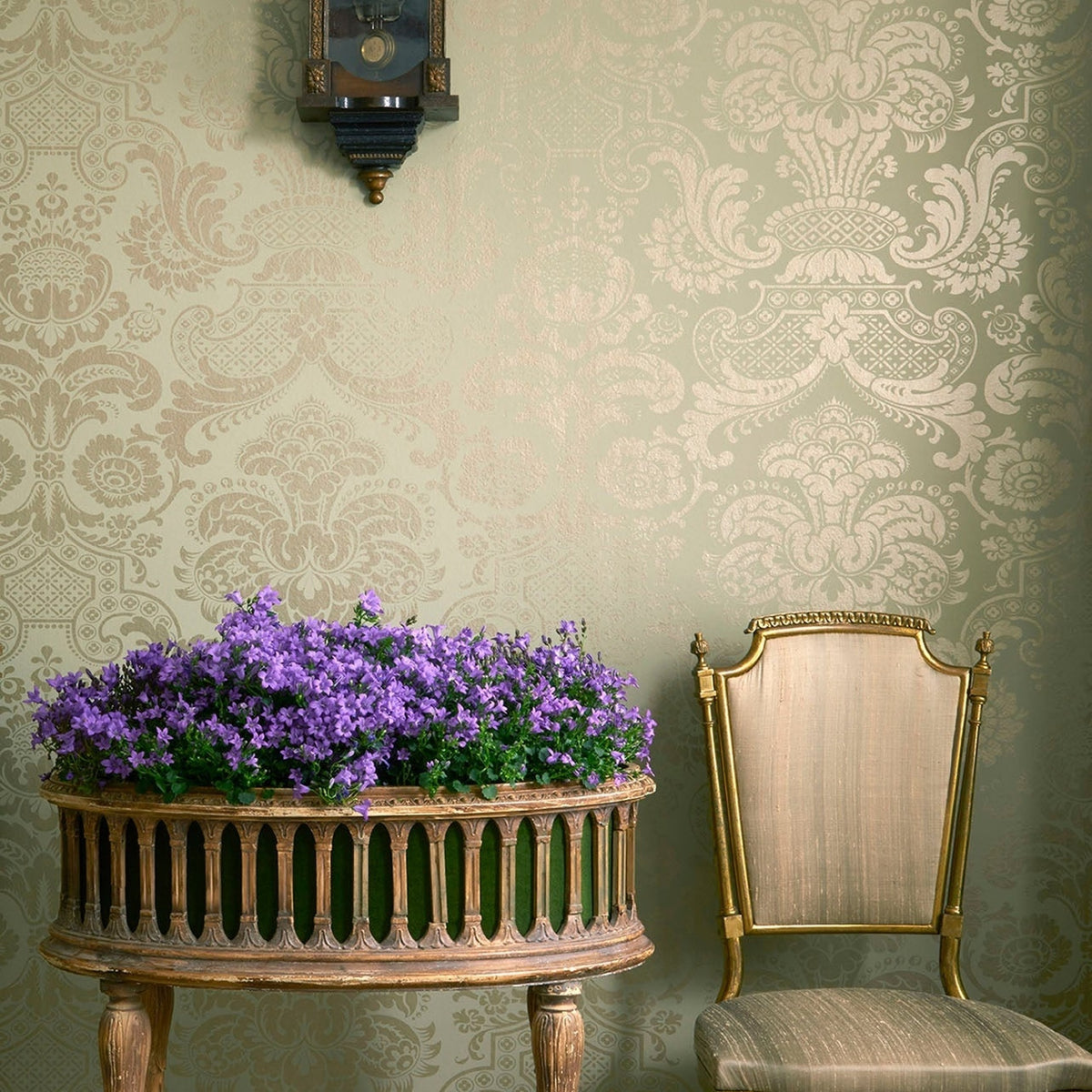 Cole & Son carmen wallpaper in Metallic Antique Metallic Gold on Soft Olive — lifestyle