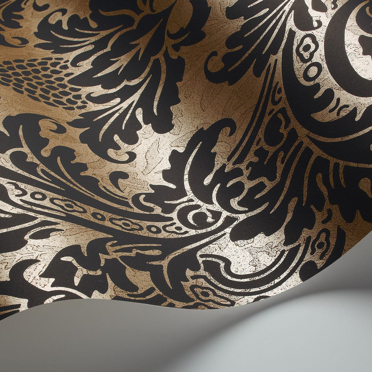 Cole & Son Blake wallpaper in Black on Metallic Gold — detail