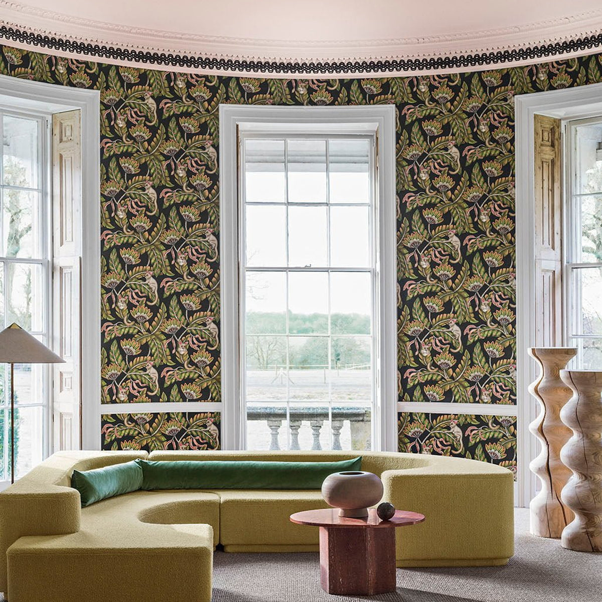 Cole & Son Bush Baby wallpaper in Spring Green & Orange on Black — room setting