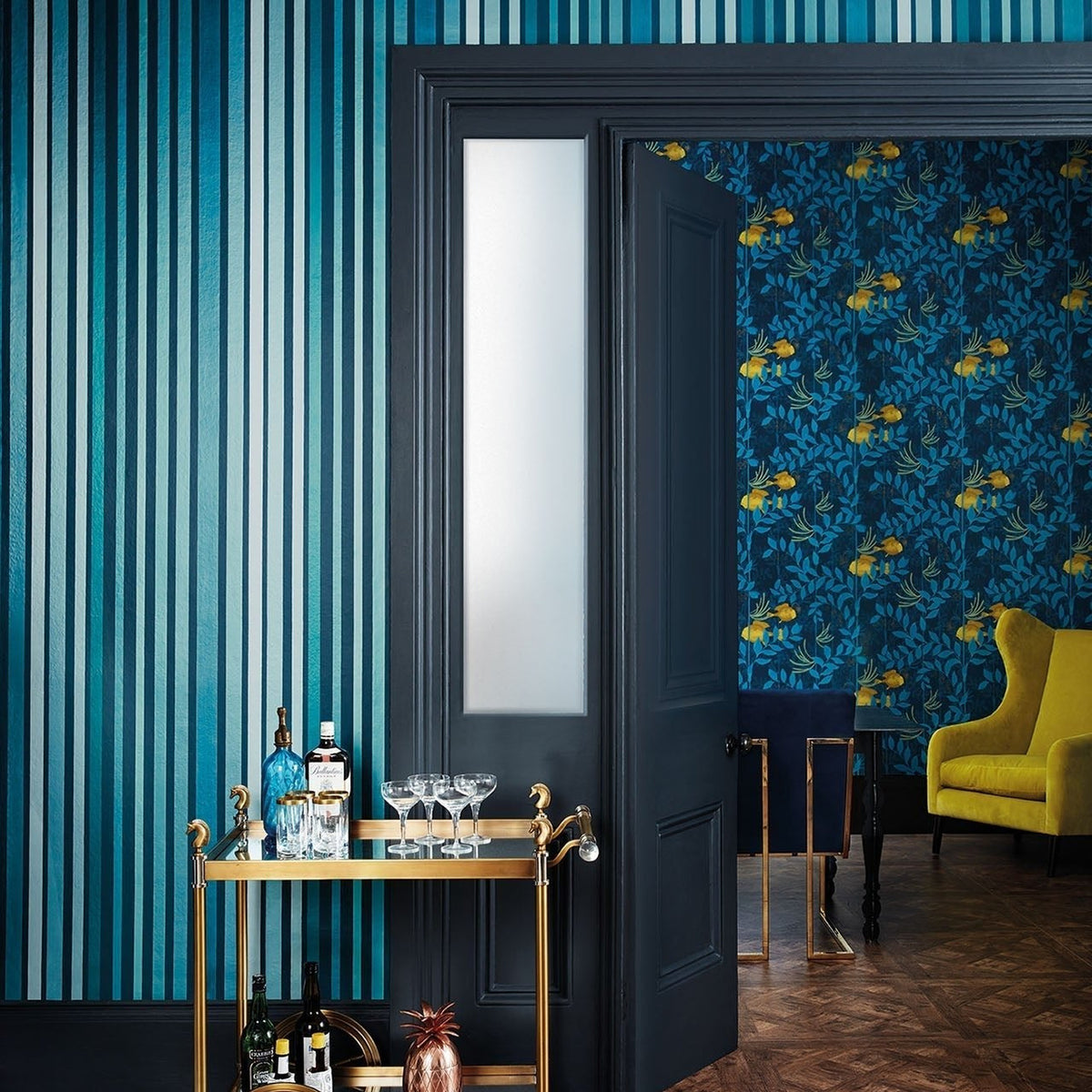 Cole & Son Carousel Stripe wallpaper in Petrol on Ink — room setting