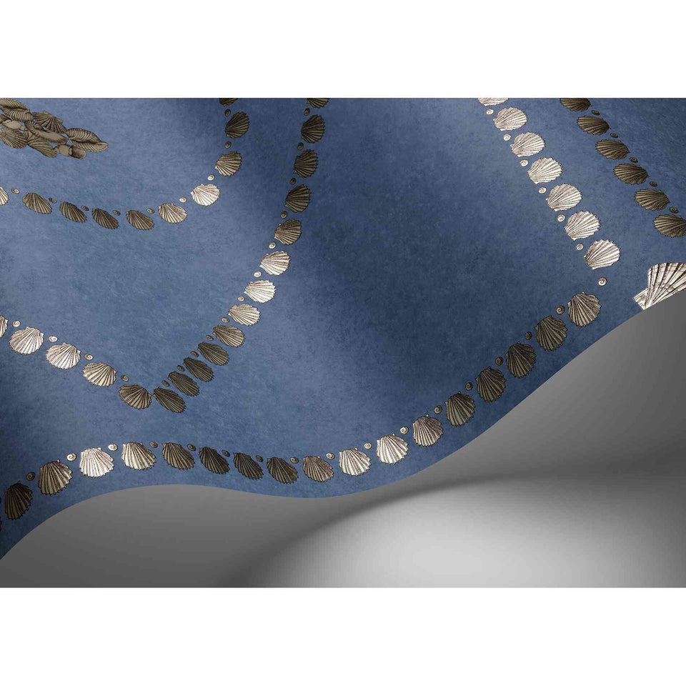 Cole & Son Conchiglie wallpaper in Gilver on Denim in an interior