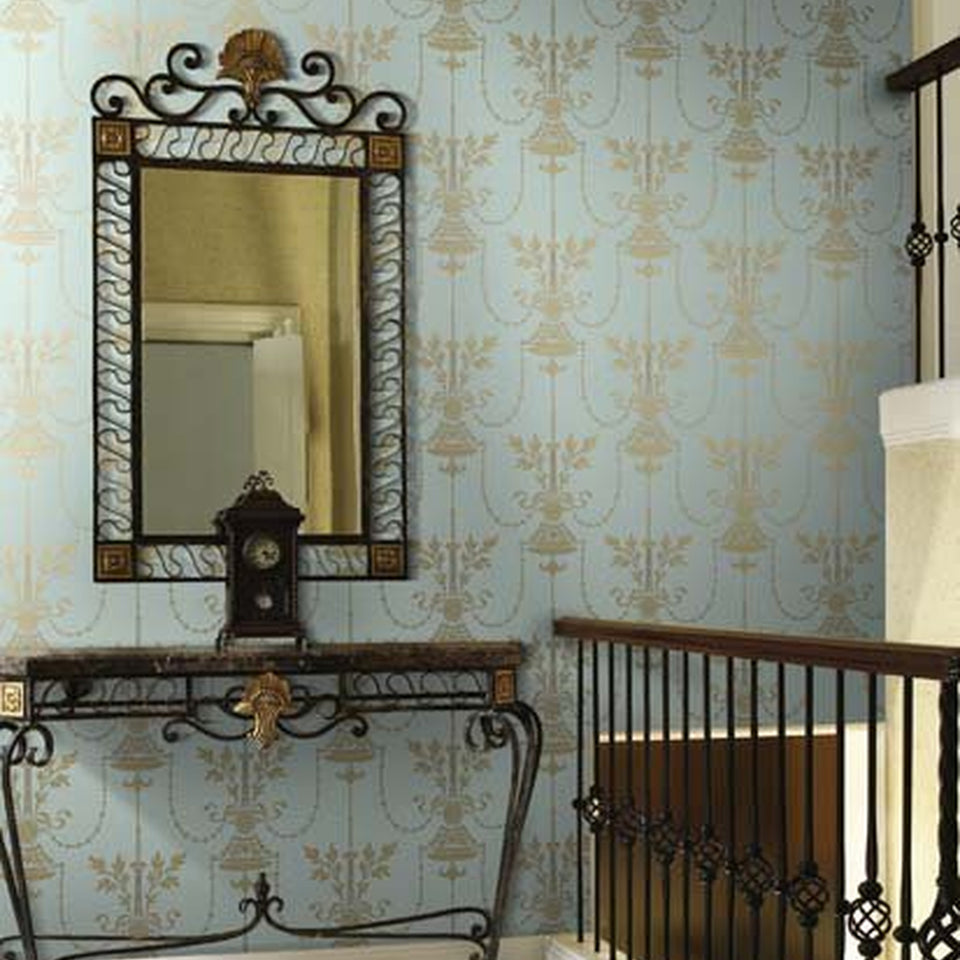 Dorset wallpaper by Cole & Son in Metallic Gold on Print Room Blue, shown in an interior