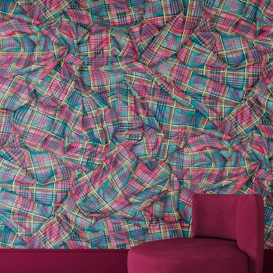 Cole & Son Draped Tartan in Cyan & Magenta shown behind a magenta chair
