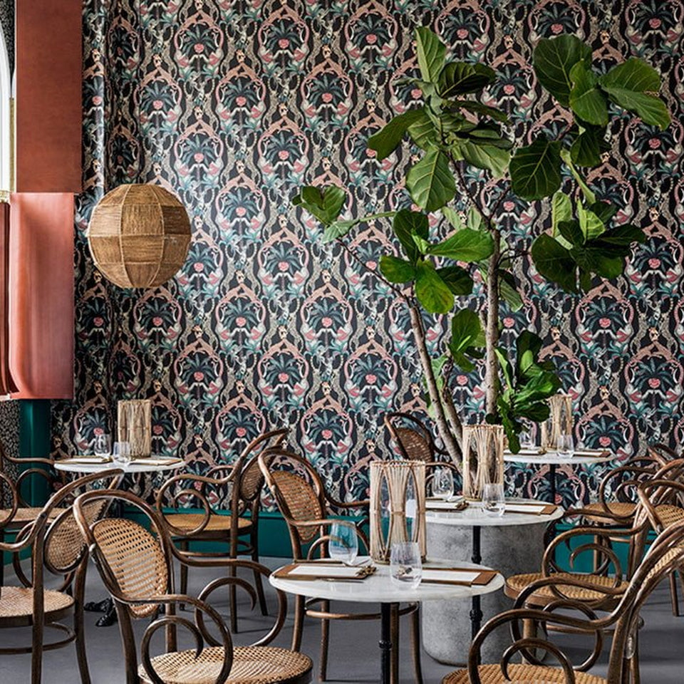 Safari Totem wallpaper by Cole & Son in Ruby & Print Room Blue on Charcoal, room setting