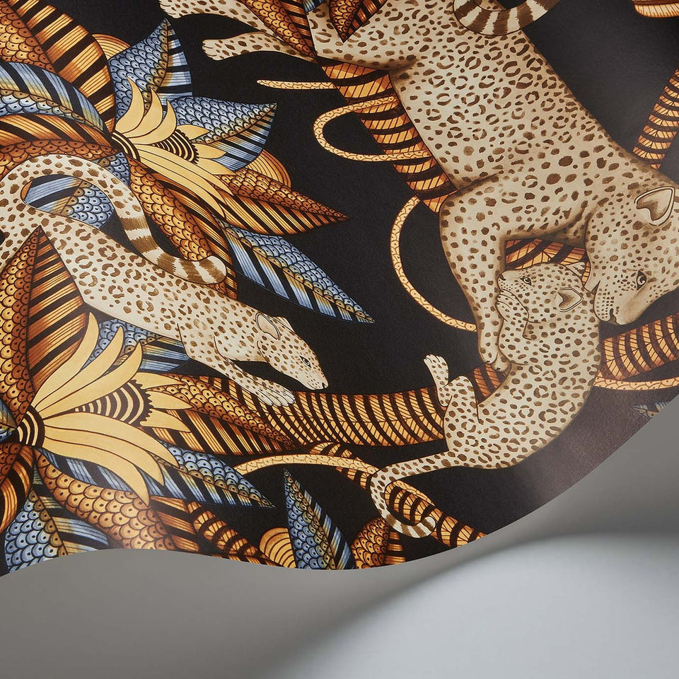 Satara wallpaper by Cole & Son in Burnt Orange & Sand on Black, curved paper detail