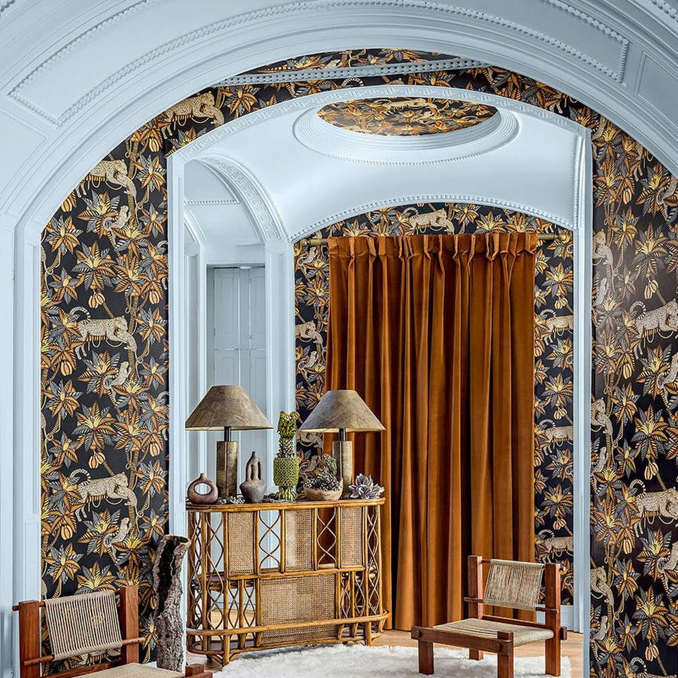 Satara wallpaper by Cole & Son in Burnt Orange & Sand on Black, room setting
