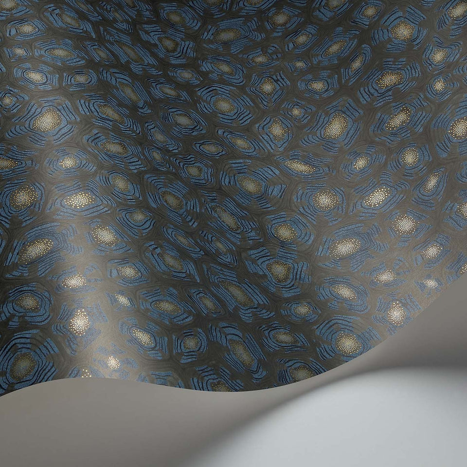 Savanna Shell wallpaper by Cole & Son in Denim, Charcoal & Metallic Gold, curved paper detail