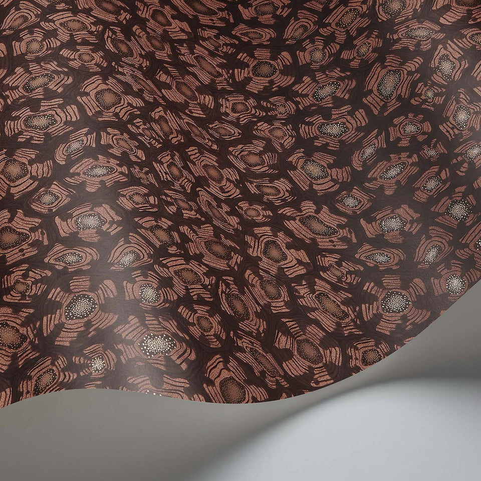 Savanna Shell wallpaper by Cole & Son in Terracotta, Claret & Metallic Gold, curved paper detail