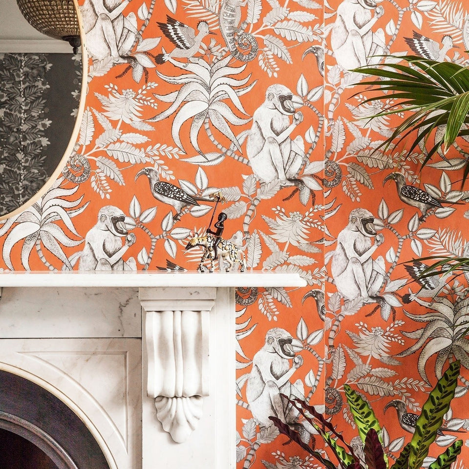 Savuti wallpaper by Cole & Son in Soot on Tangerine, room setting