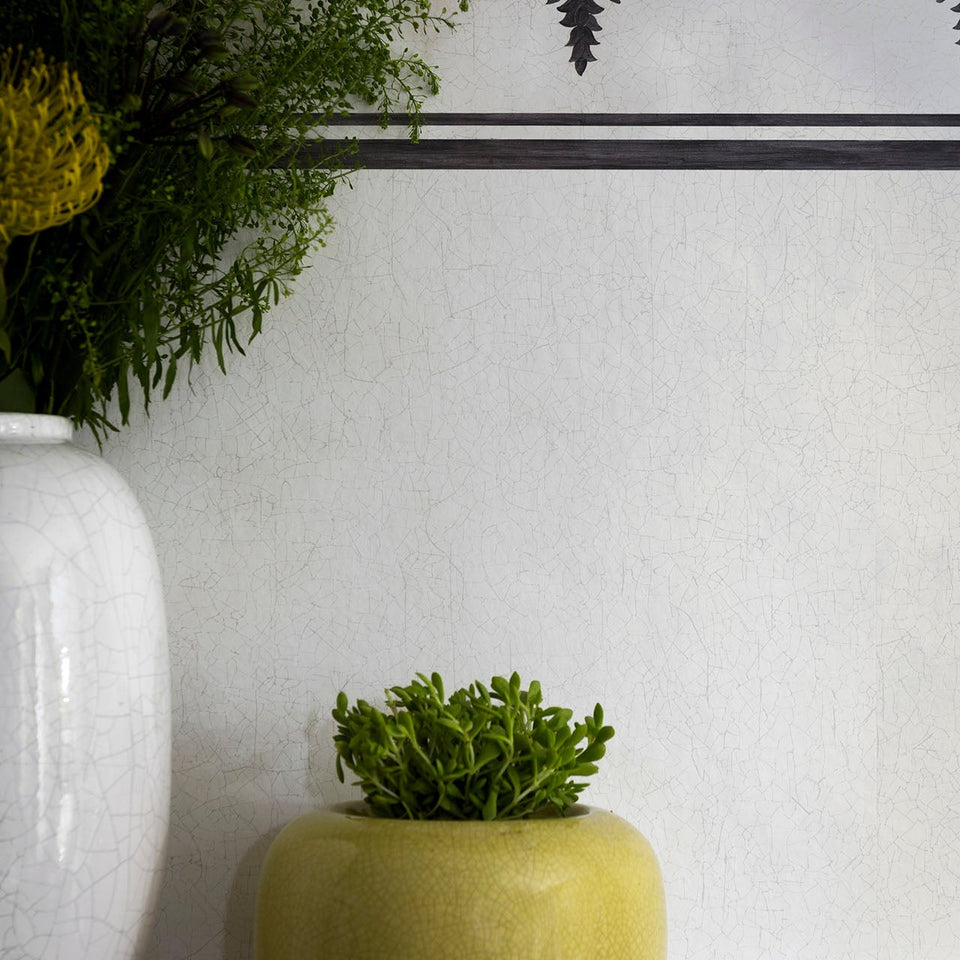 Trianon wallpaper in Chalk in a styled interior
