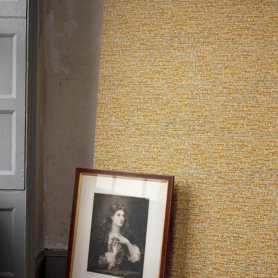 Tweed wallpaper by Cole & Son in Chartreuse & Burnt Orange on Soot in a styled interior