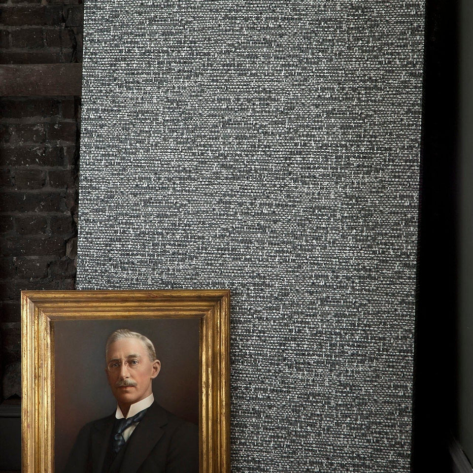 Tweed wallpaper by Cole & Son in Charcoal & Grey on Black in a styled interior