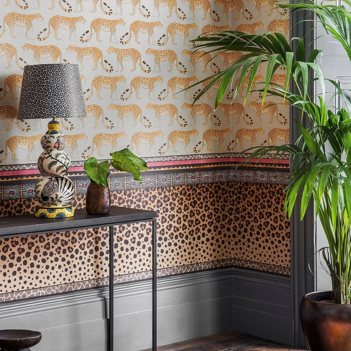 Cole & Son Zulu Border in Ginger & Soot — room setting, border shown with coordinating wallpaper